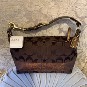 Coach handbag brown traditional “C” pattern with bronze trim and bronze strap